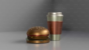 a metallic burger and a cup of coffee