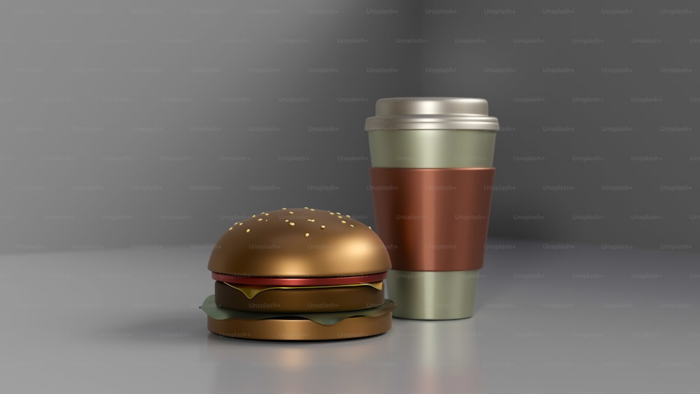 a metallic burger and a cup of coffee