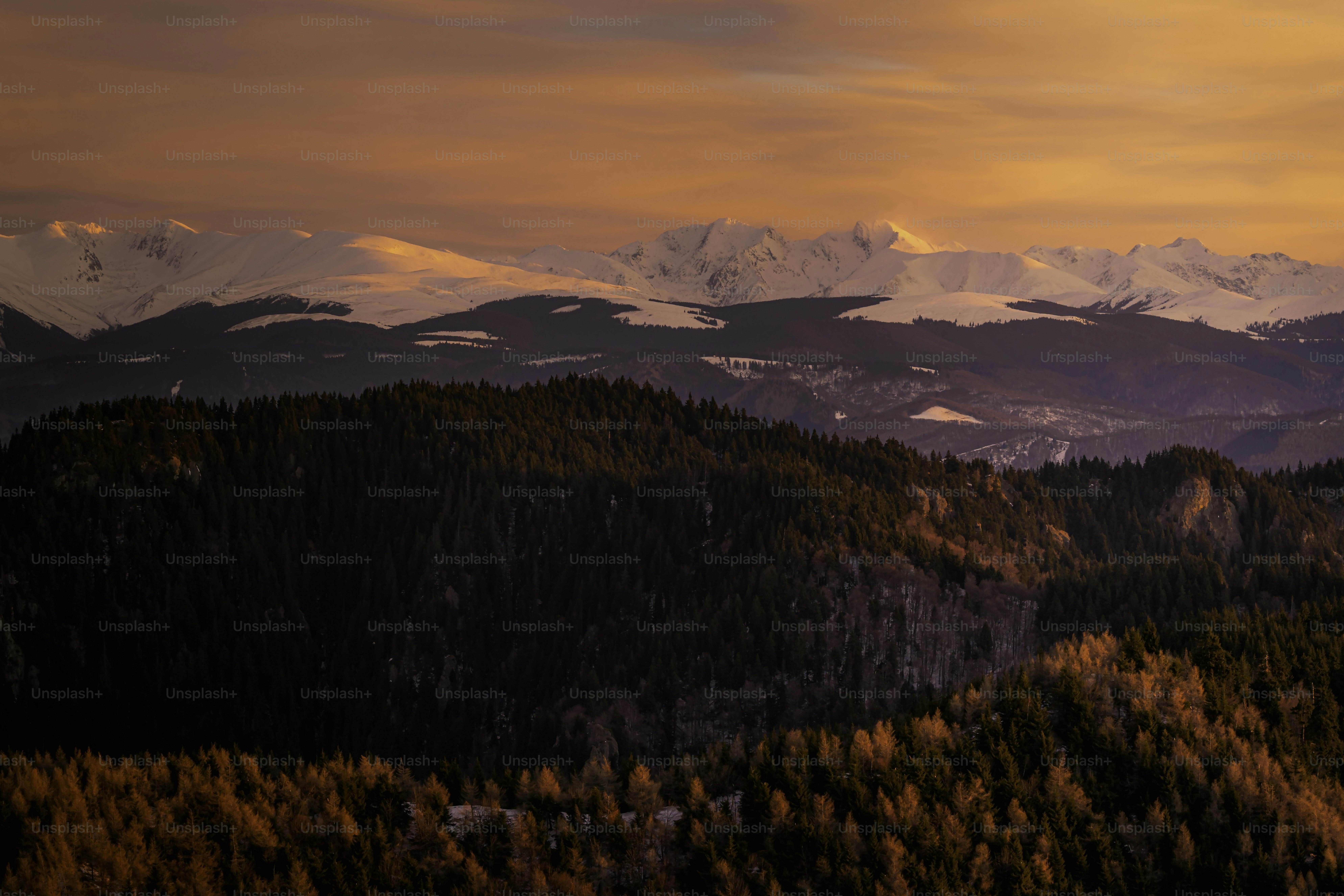 a view of a mountain range at sunset