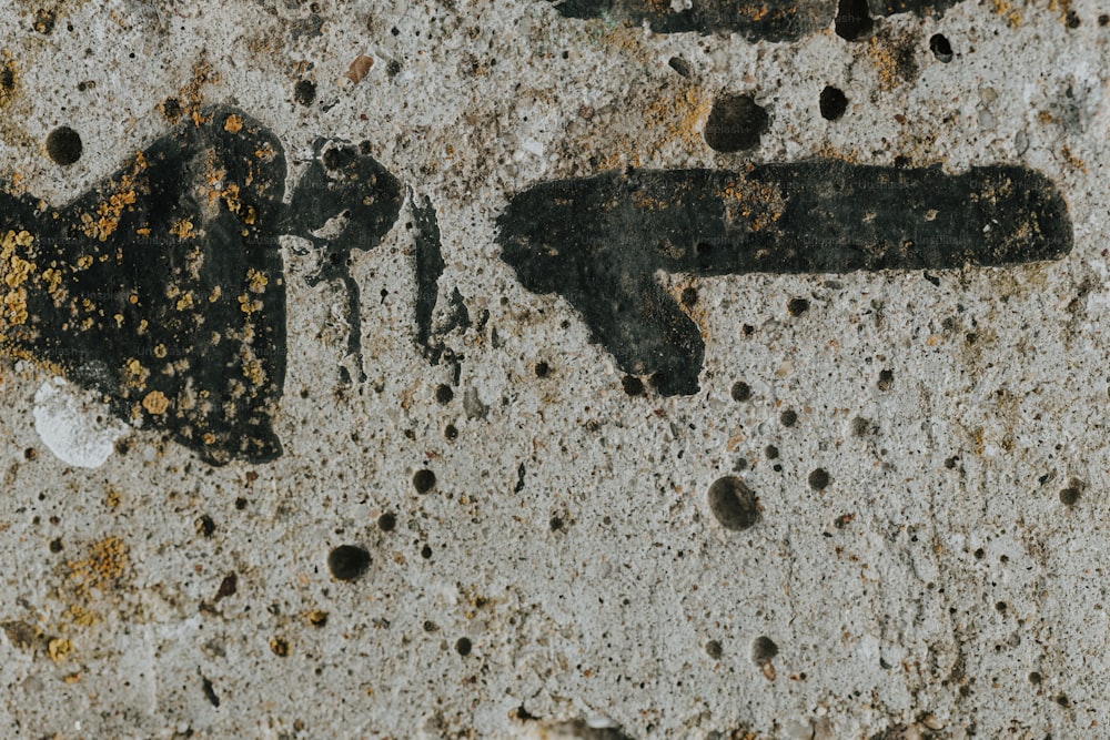 a close up of a rusted metal object on a wall