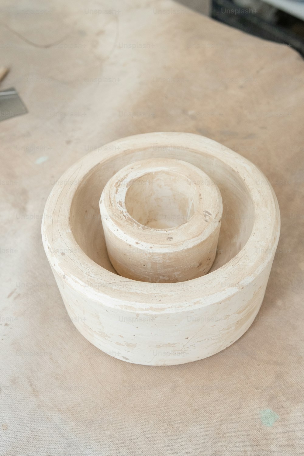 a wooden bowl sitting on top of a table