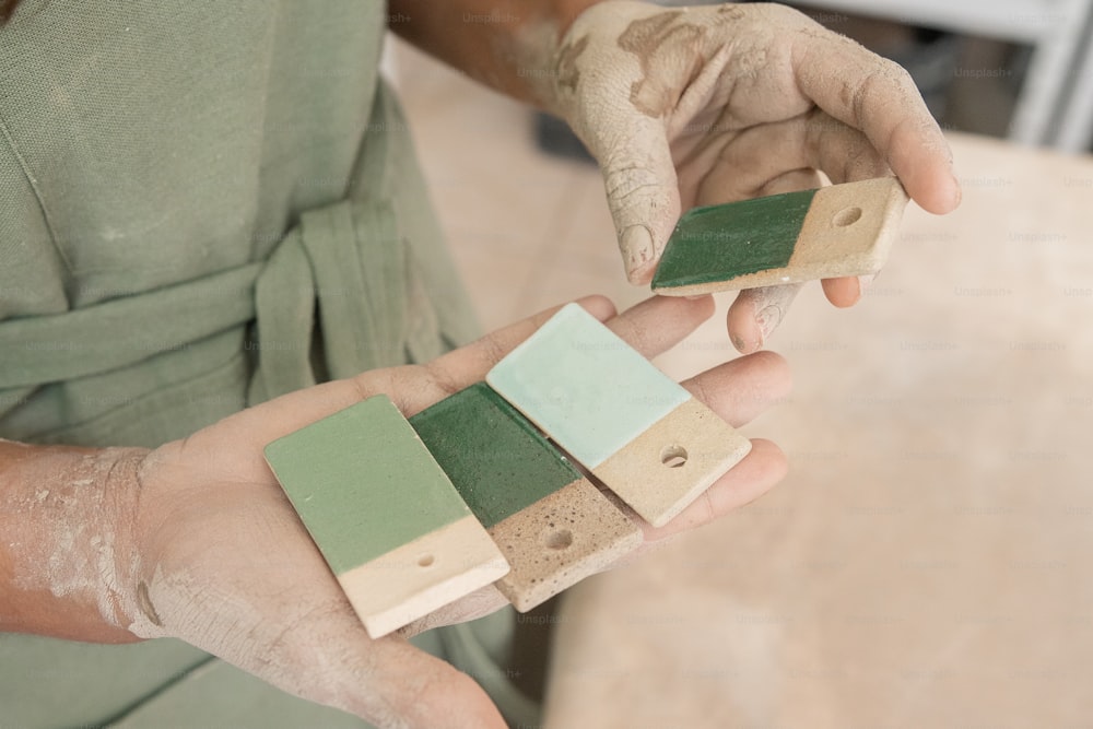 a person holding a piece of wood in their hands