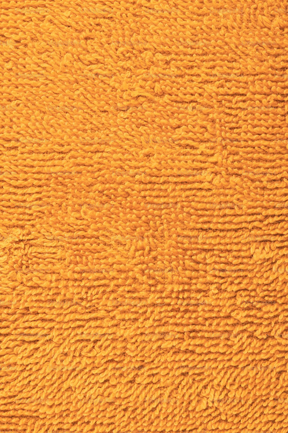 Un primo piano di una parete arancione strutturata