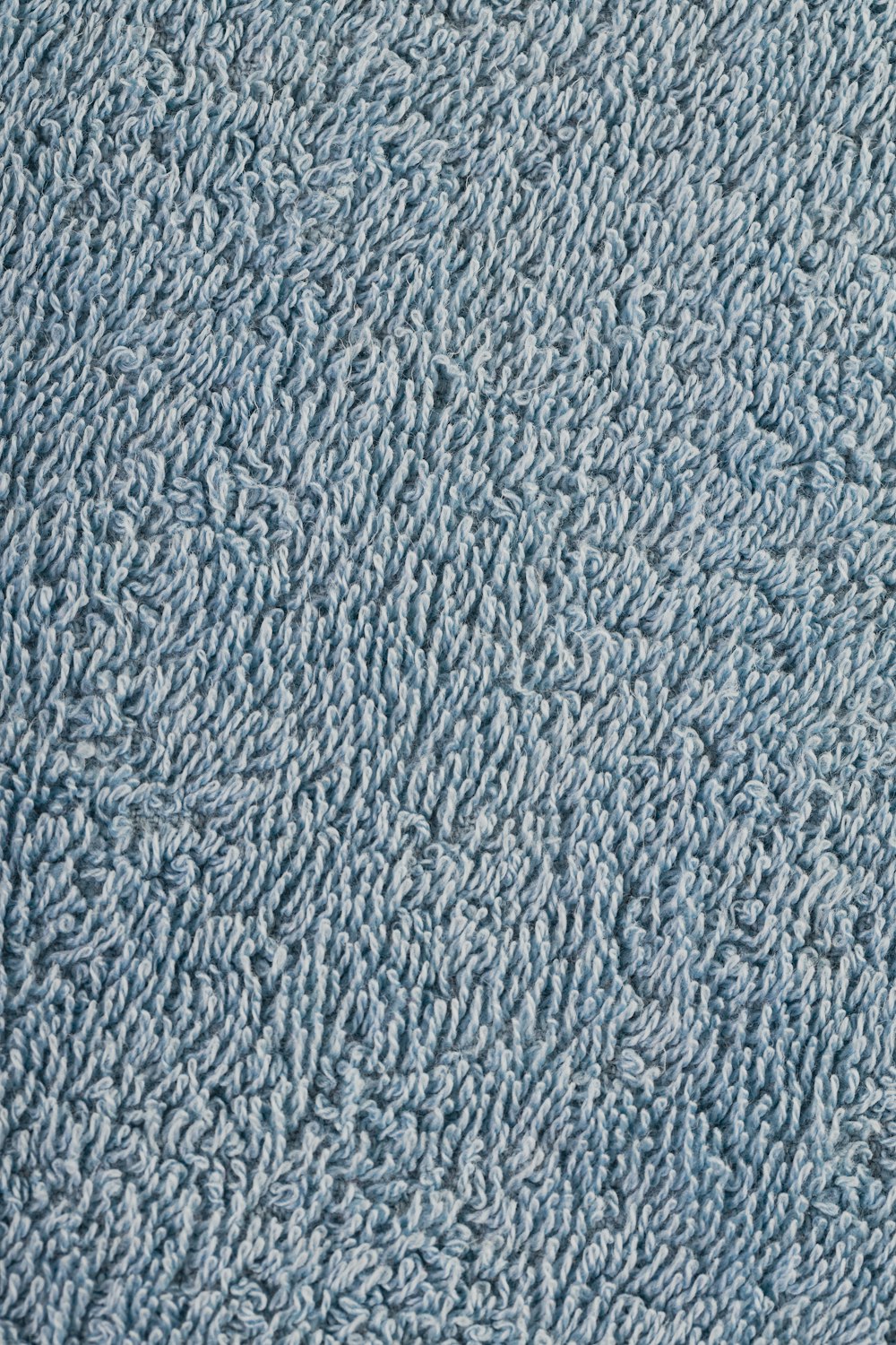 Nahaufnahme einer Textur mit blauem Teppich
