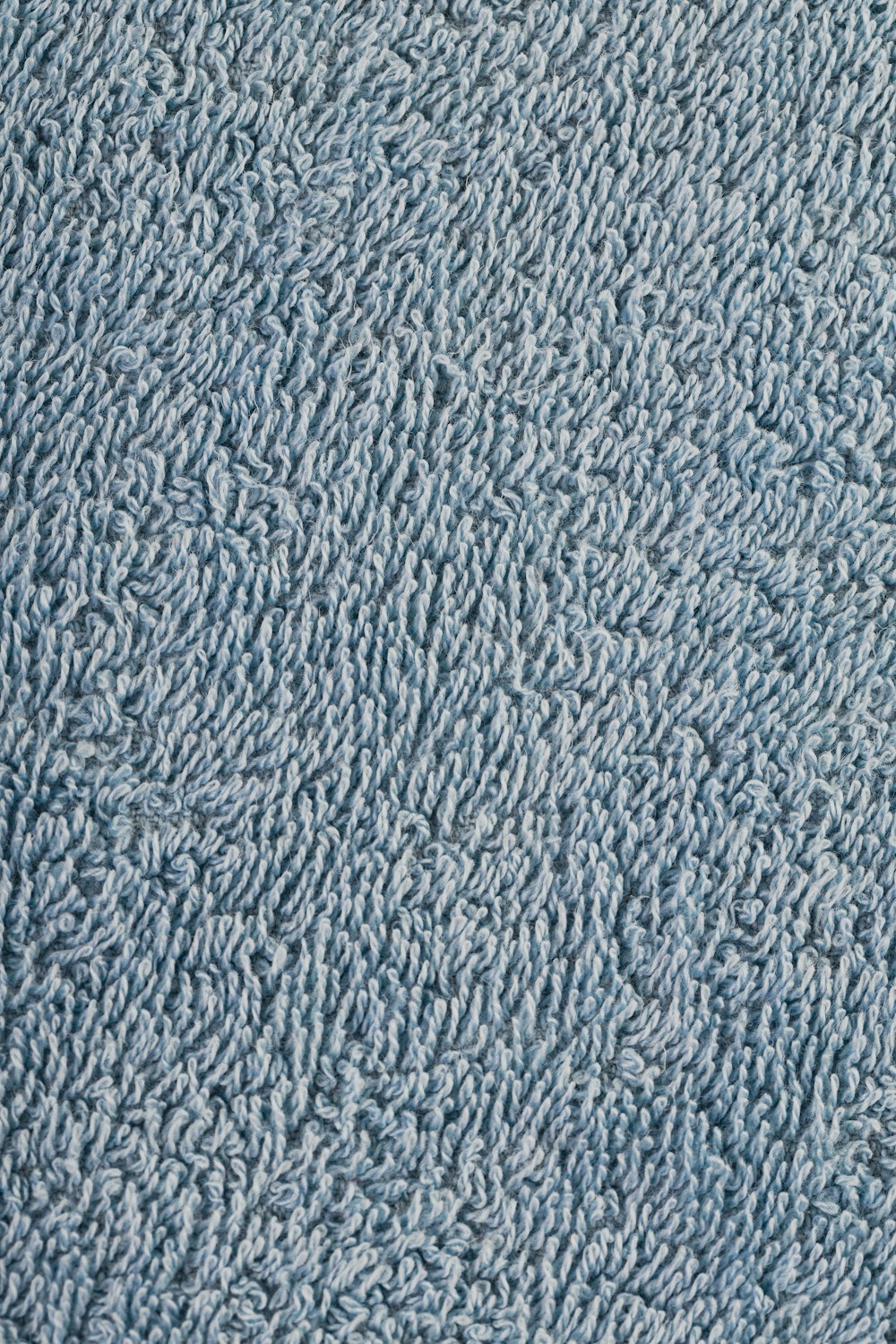 a close up of a blue carpet texture