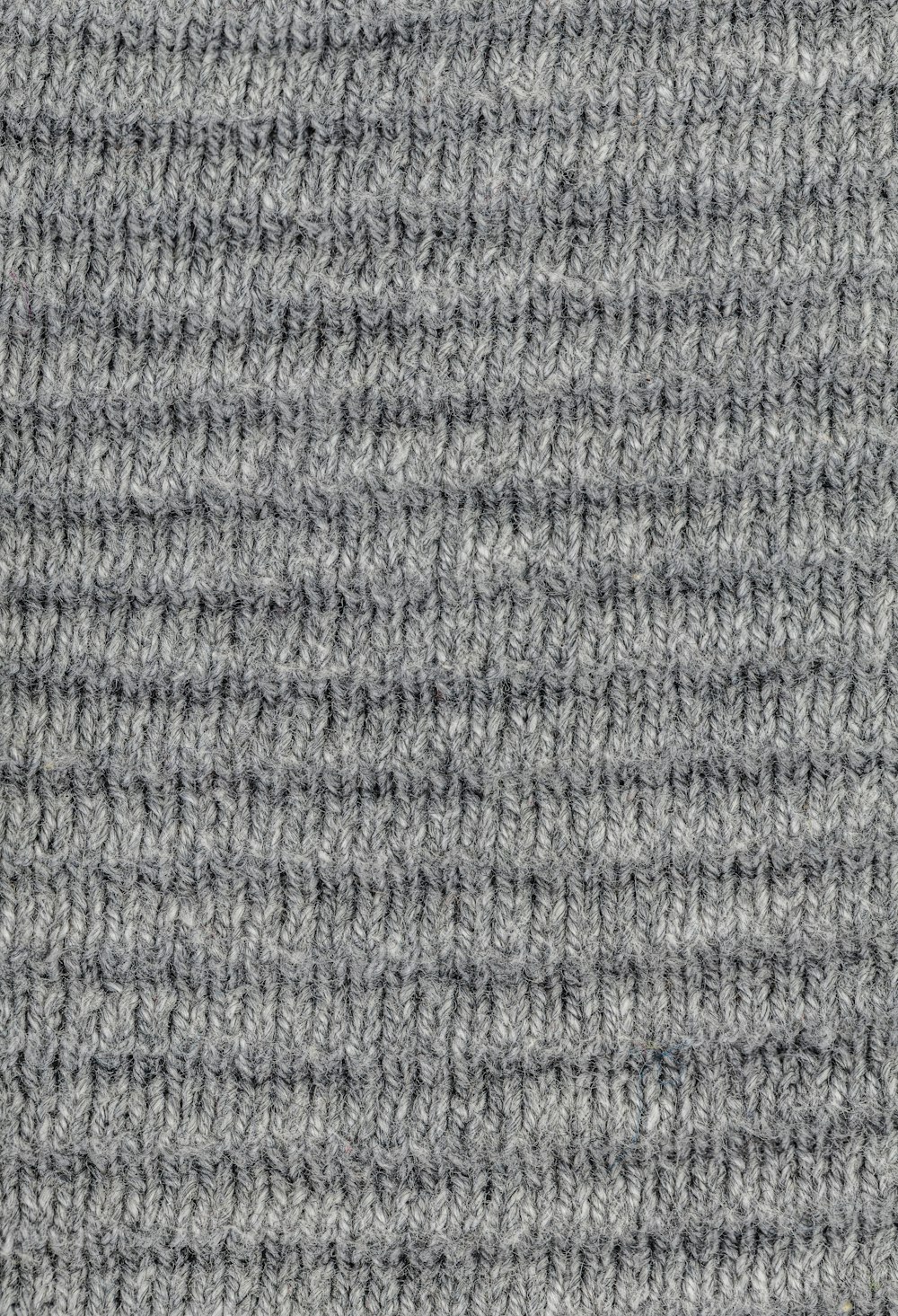 a close up of a gray knitted material