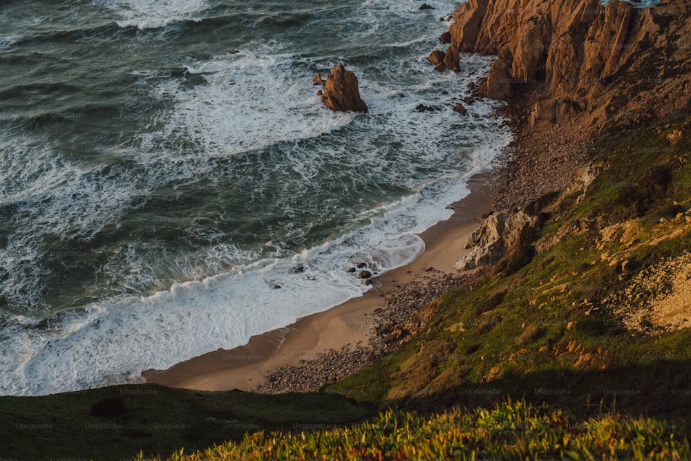 a view of the ocean from the top of a hill