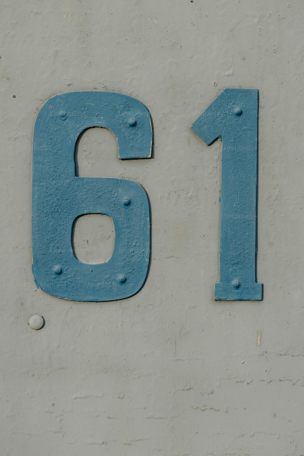 a close up of a number on a wall