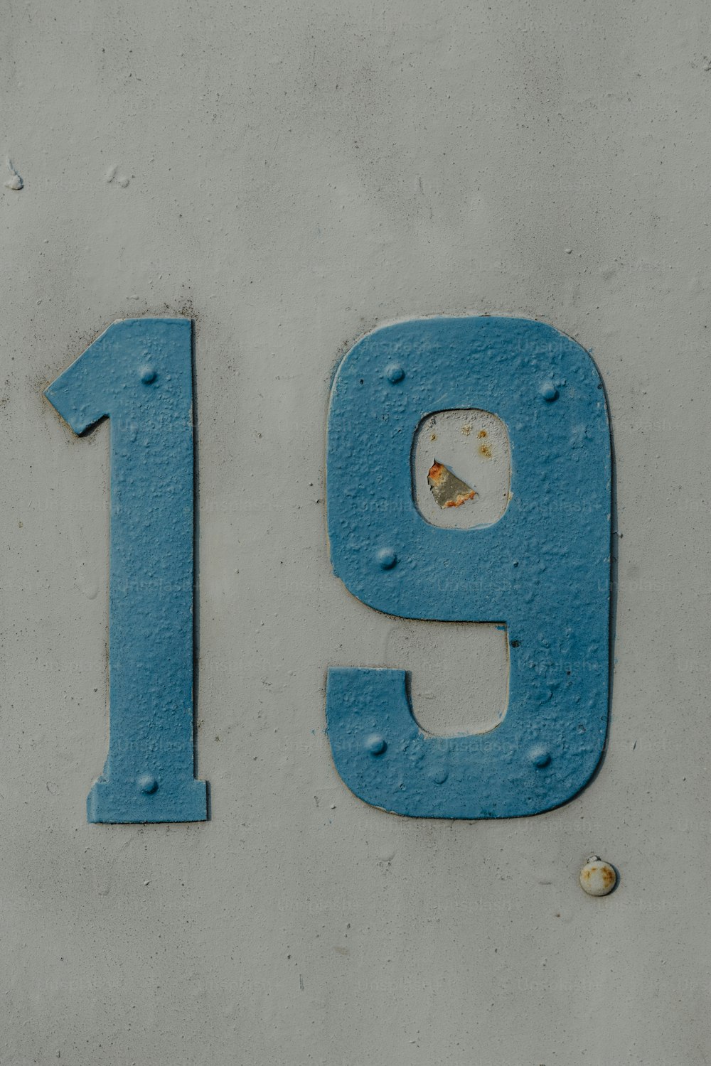 a close up of a sign with a bird on it