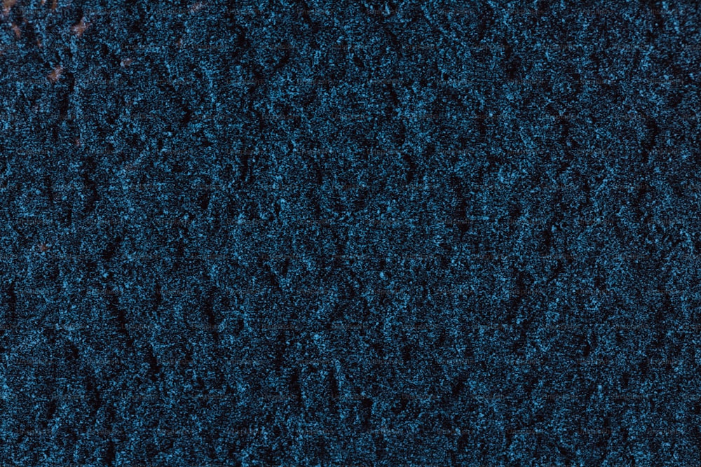 a close up of a blue carpet texture