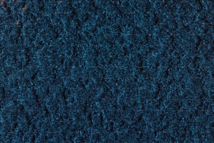 a close up of a blue carpet texture