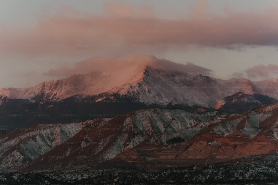 Hunter glassing a mountain basin during Colorado archery elk season with aspen trees turning gold