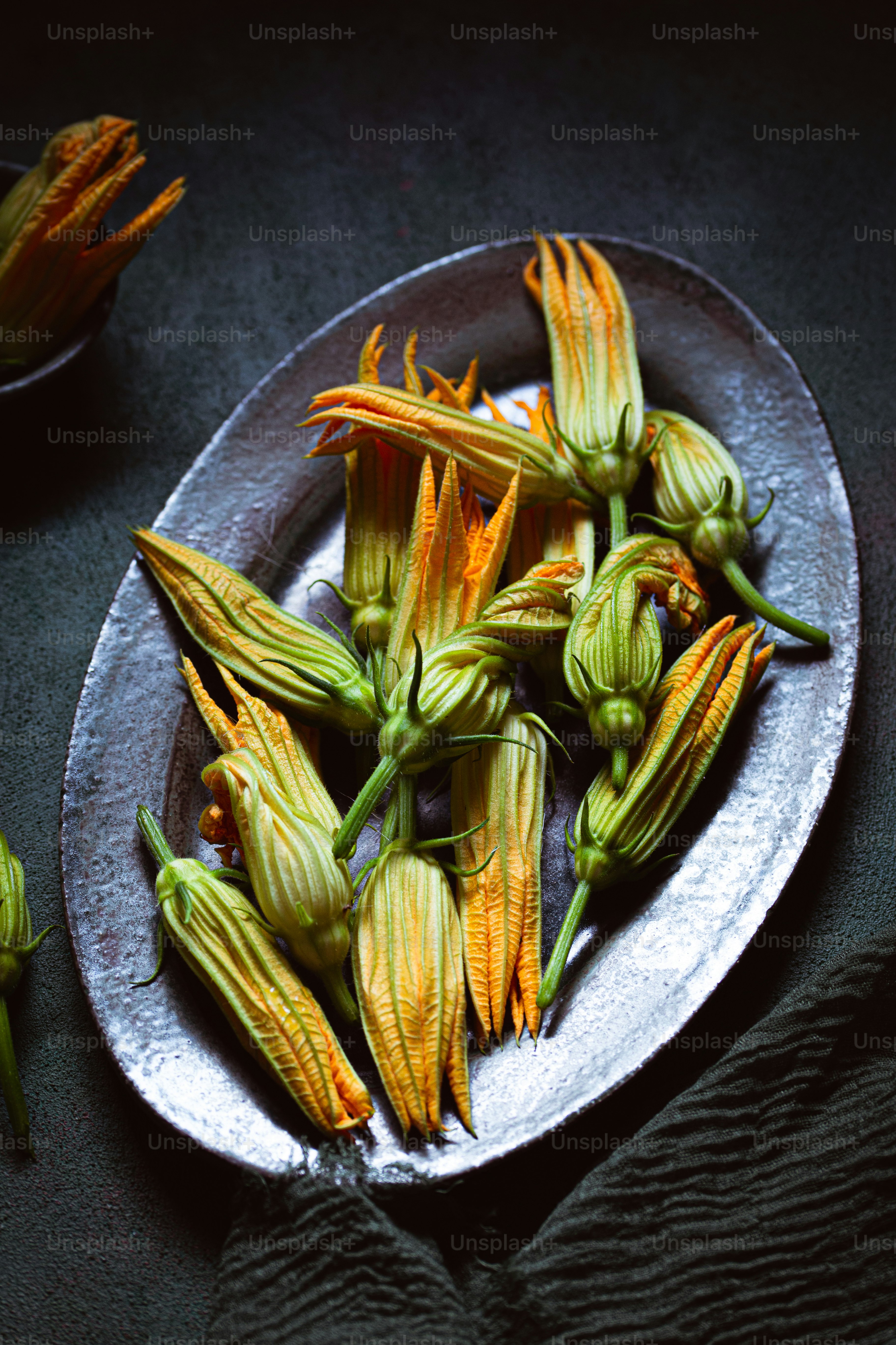 a white plate topped with flowers on top of a table