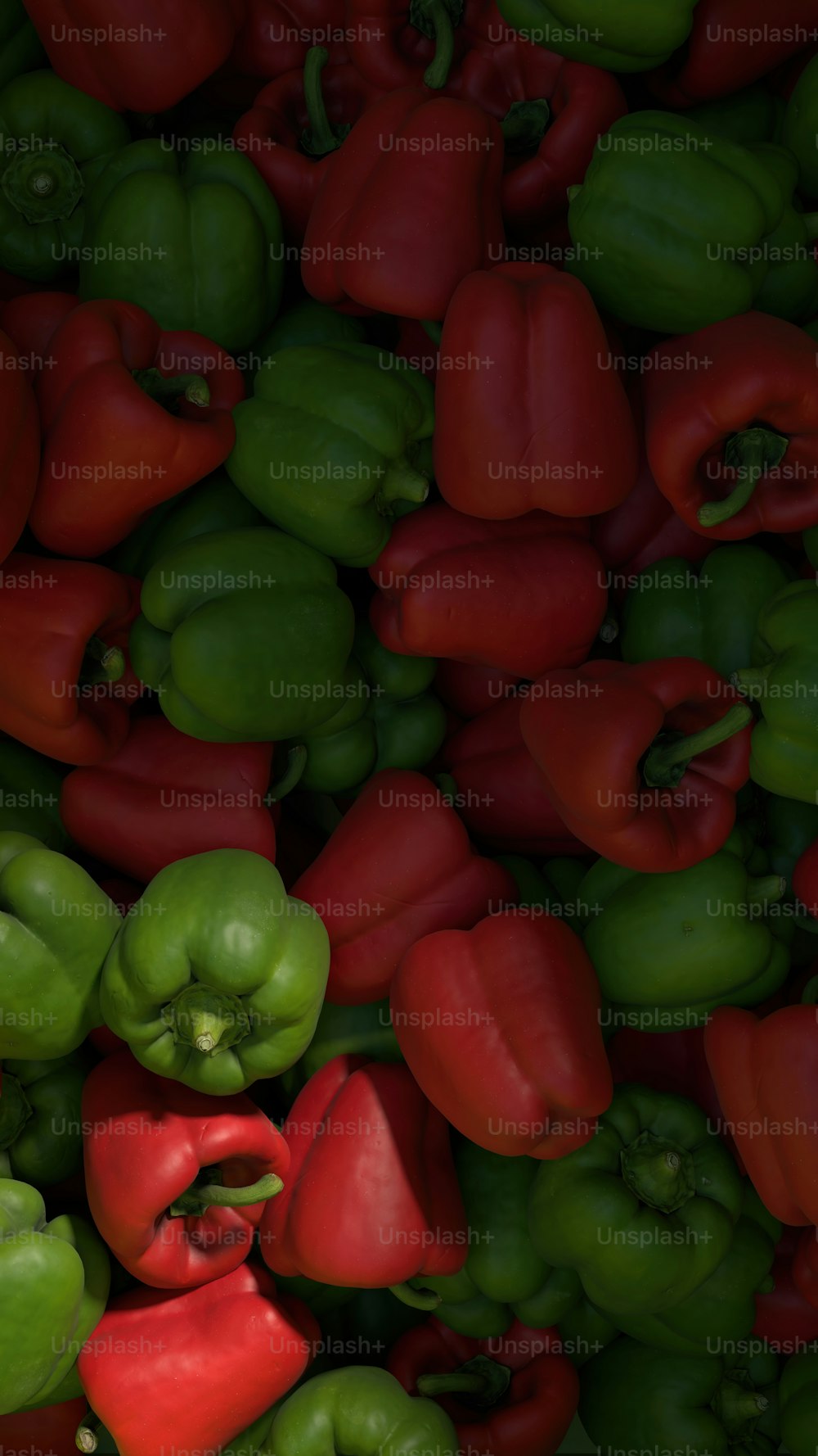 a large pile of green and red peppers