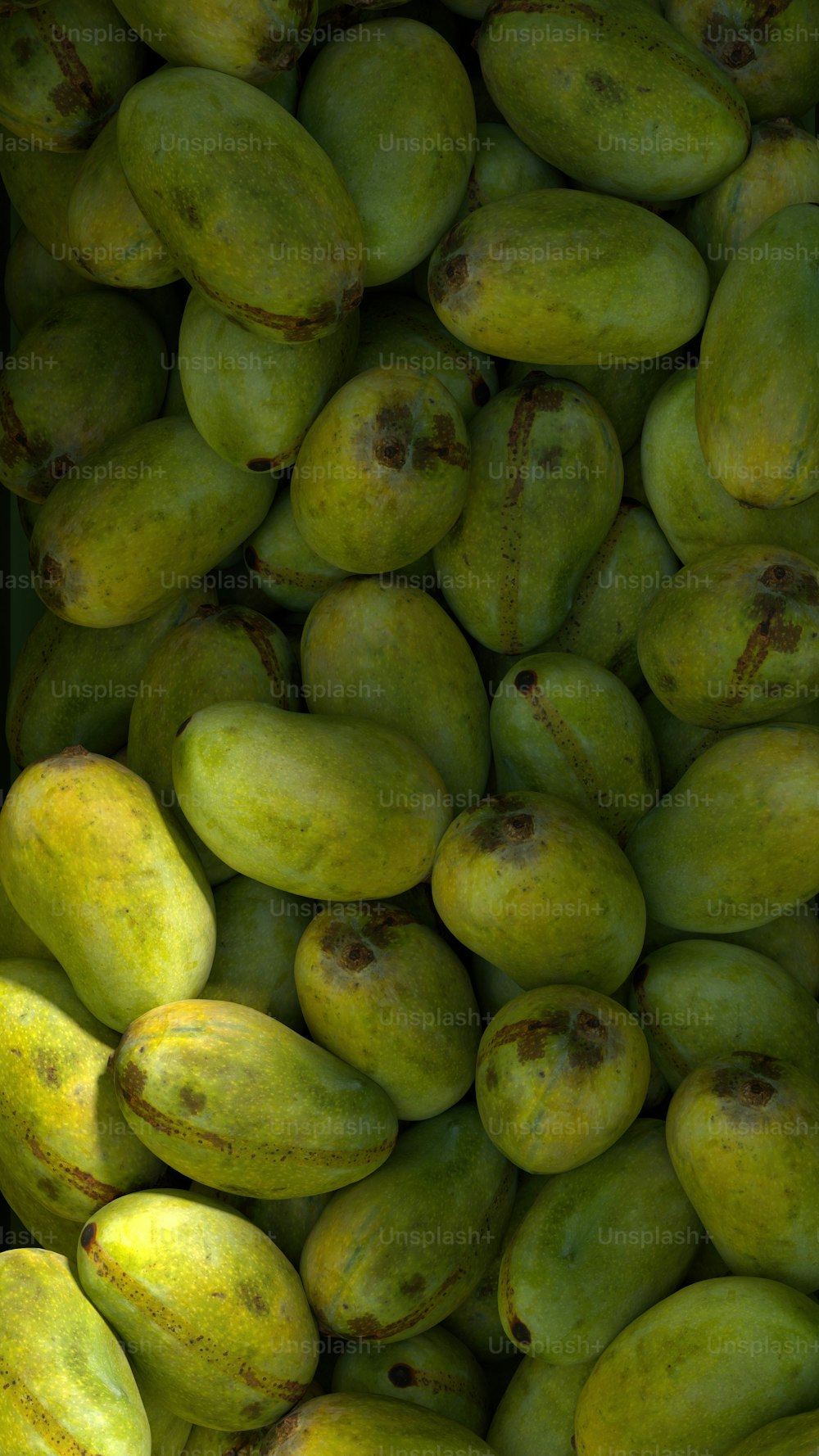 a pile of mangoes sitting next to each other