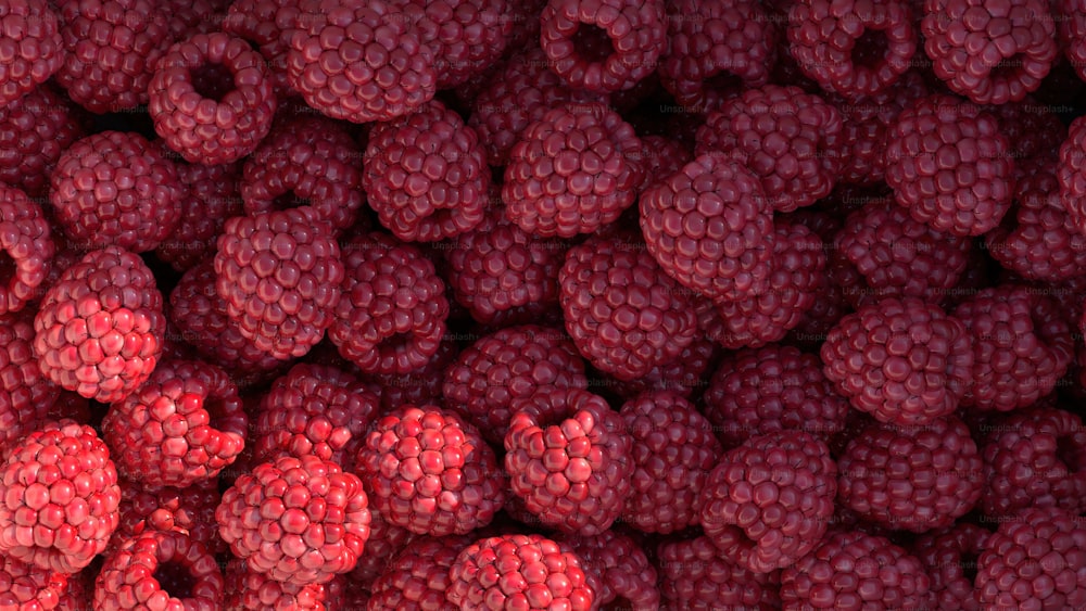 a pile of raspberries is shown close up