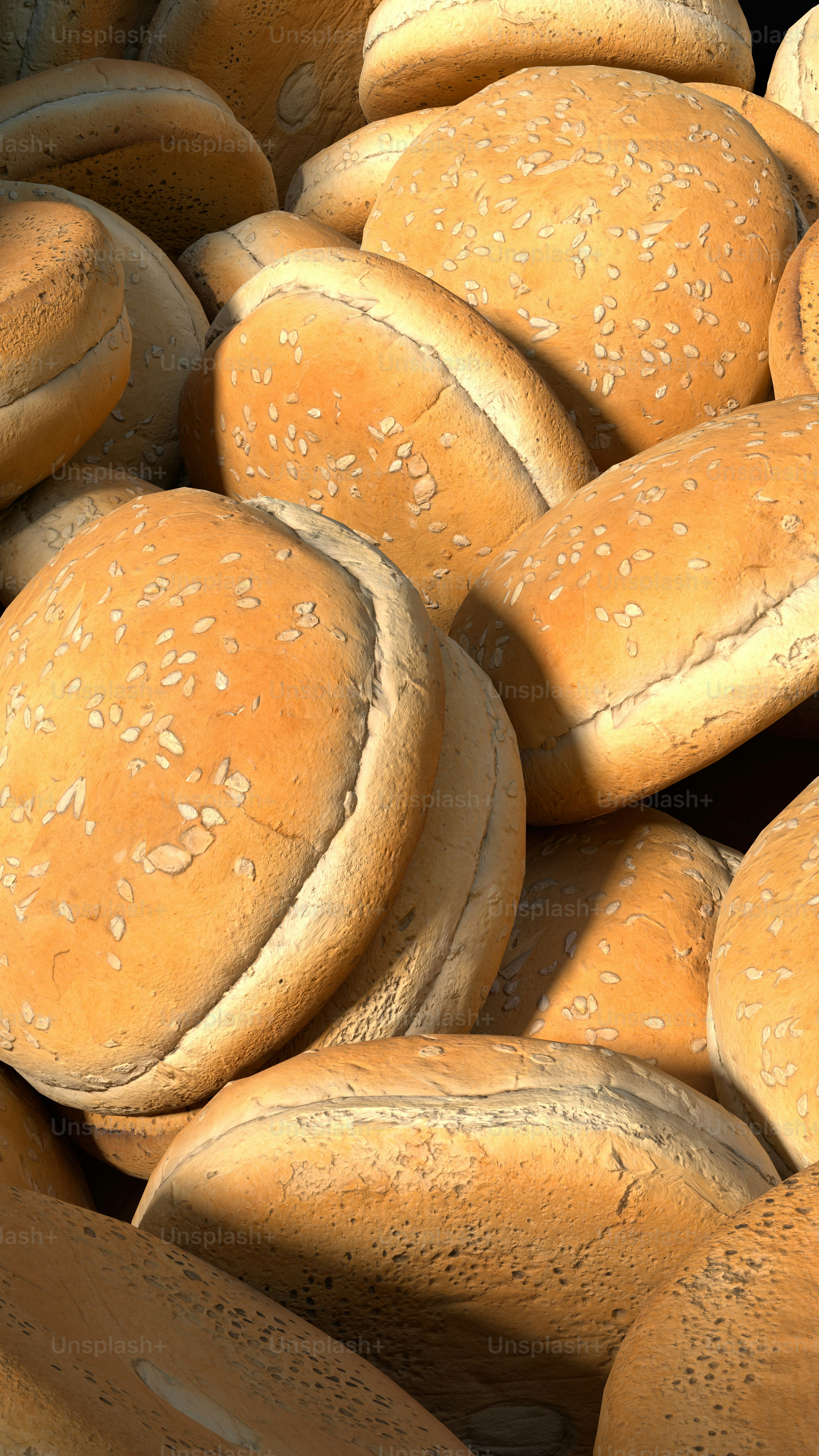 Foto zum Thema Ein Haufen Brötchen mit Sesam darauf – Bild zu Brötchen ...