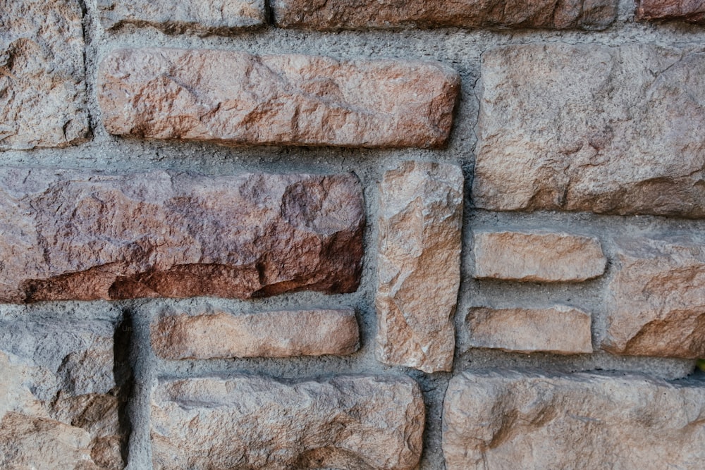 a close up of a wall made of rocks