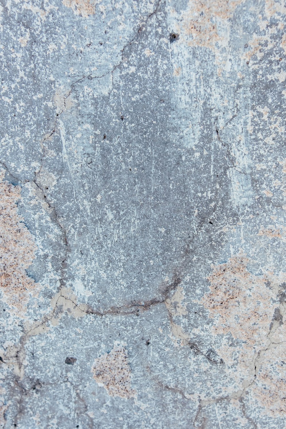 a close up of a stone surface with cracks