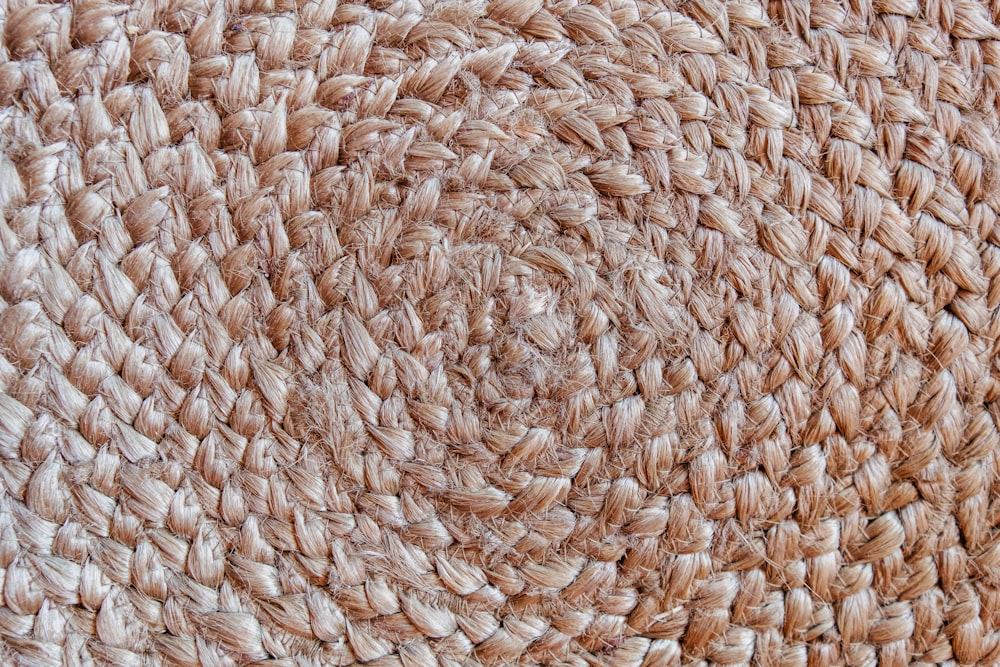 a close up view of a woven area rug
