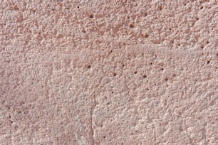 a close up of a wall with small holes in it
