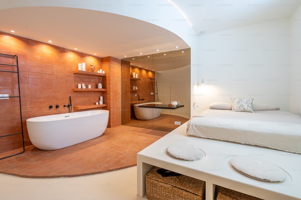 a large white bath tub sitting inside of a bathroom