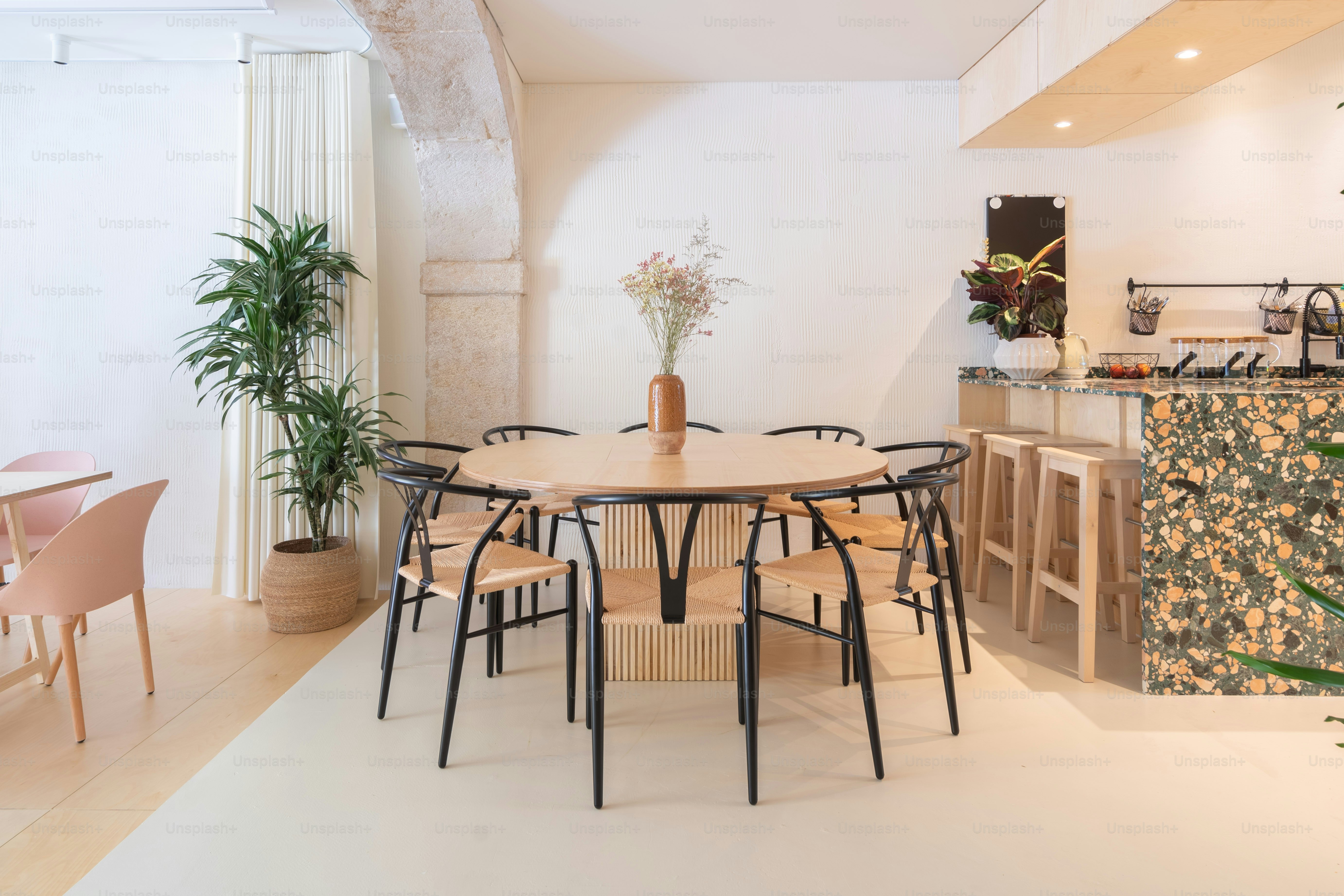 a dining room with a table and chairs