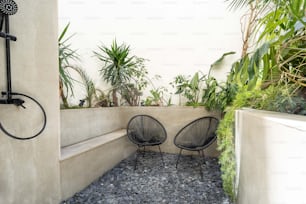 a couple of chairs sitting next to a wall