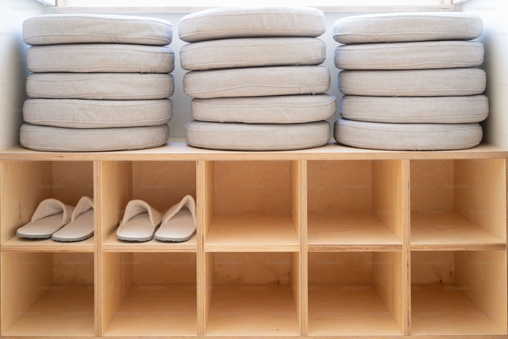 a closet filled with lots of pillows and shoes