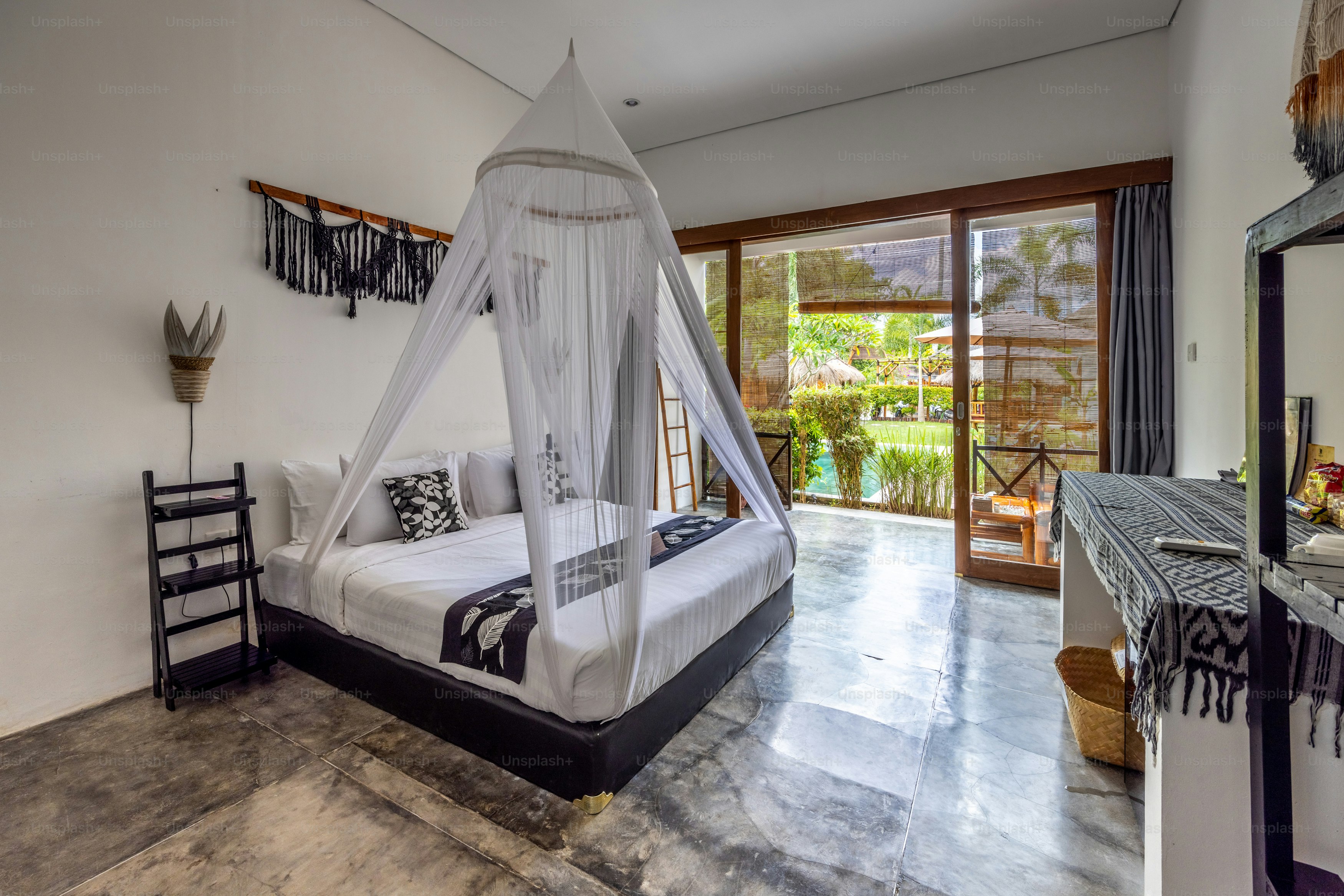 a bed with a white canopy in a room