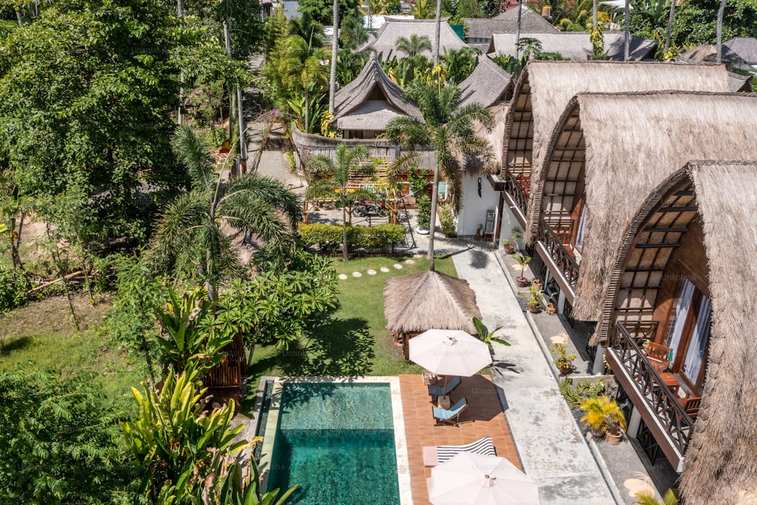 an aerial view of a resort with a swimming pool