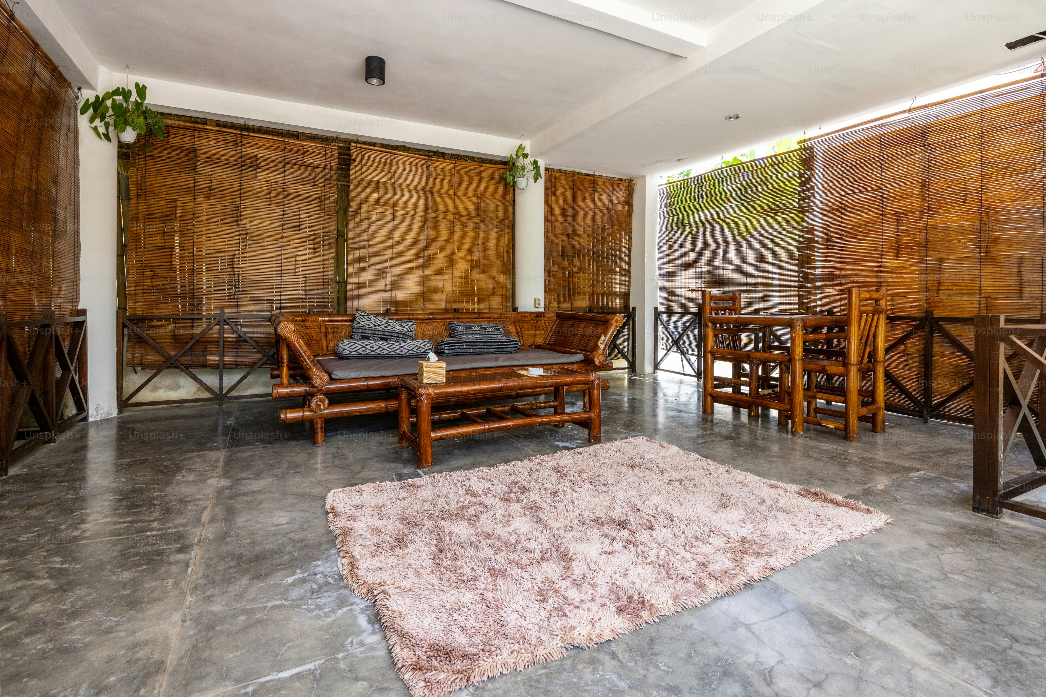 a living room filled with furniture and a rug