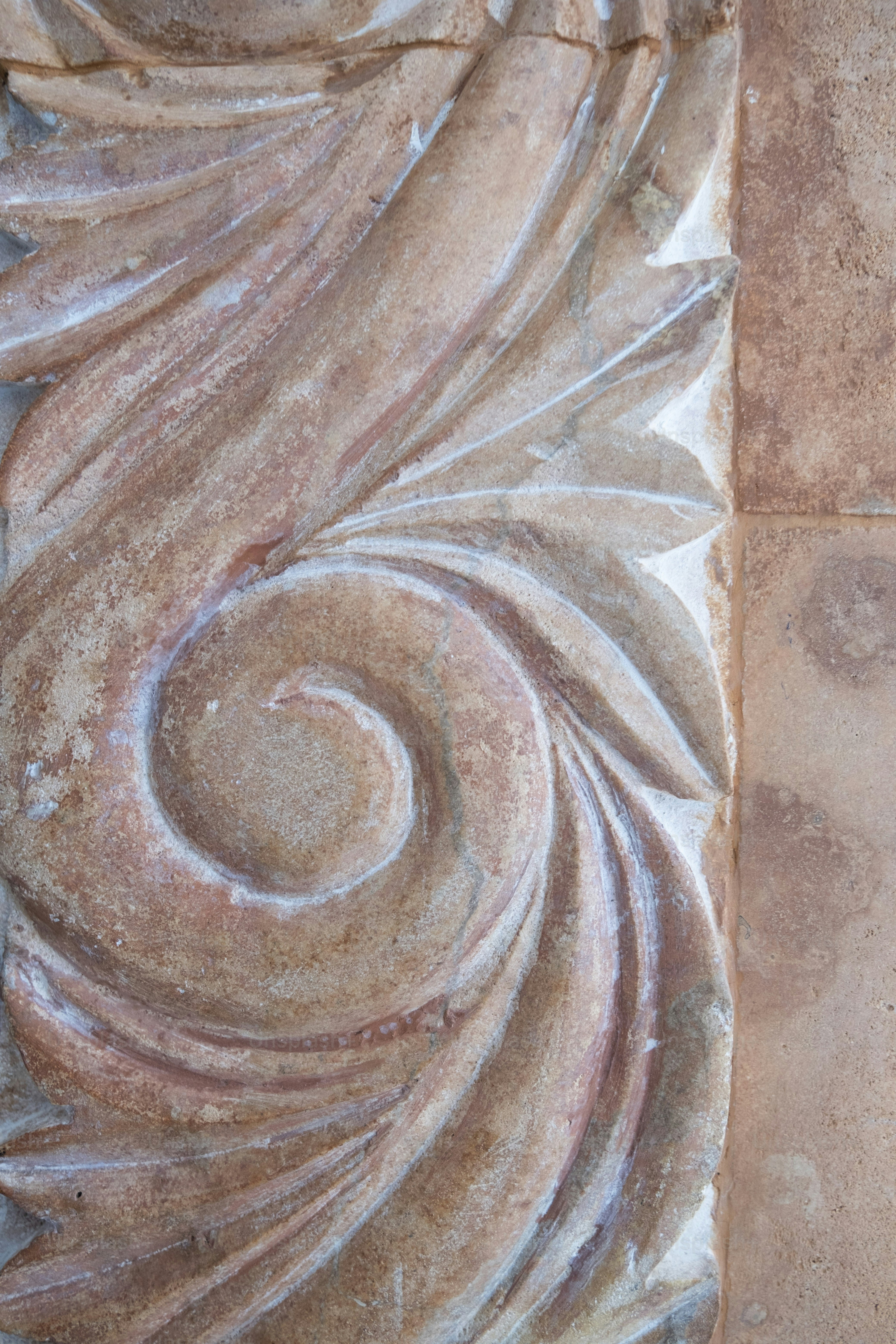 a close up of a decorative design on a wall