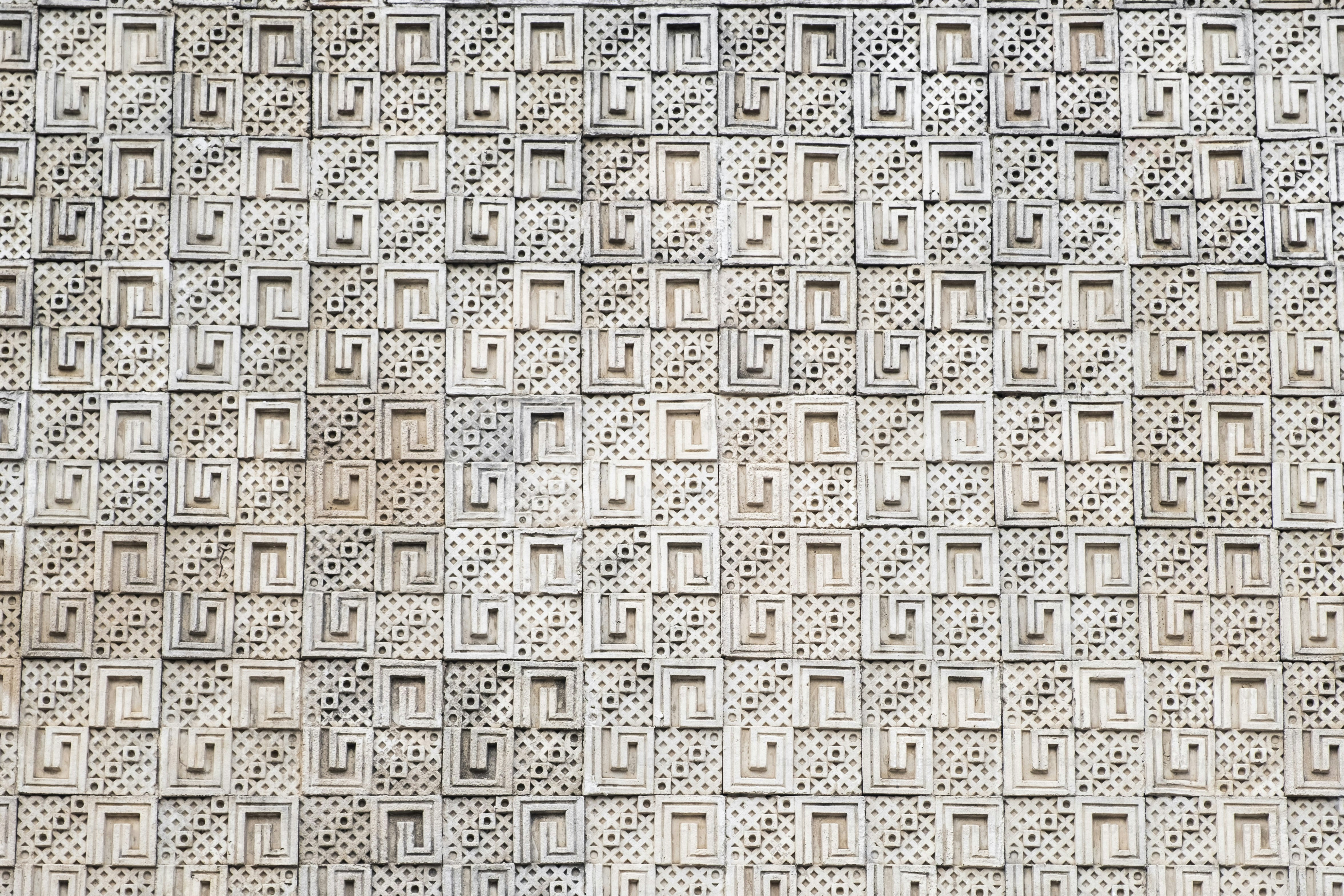 a close up of a wall with a clock on it