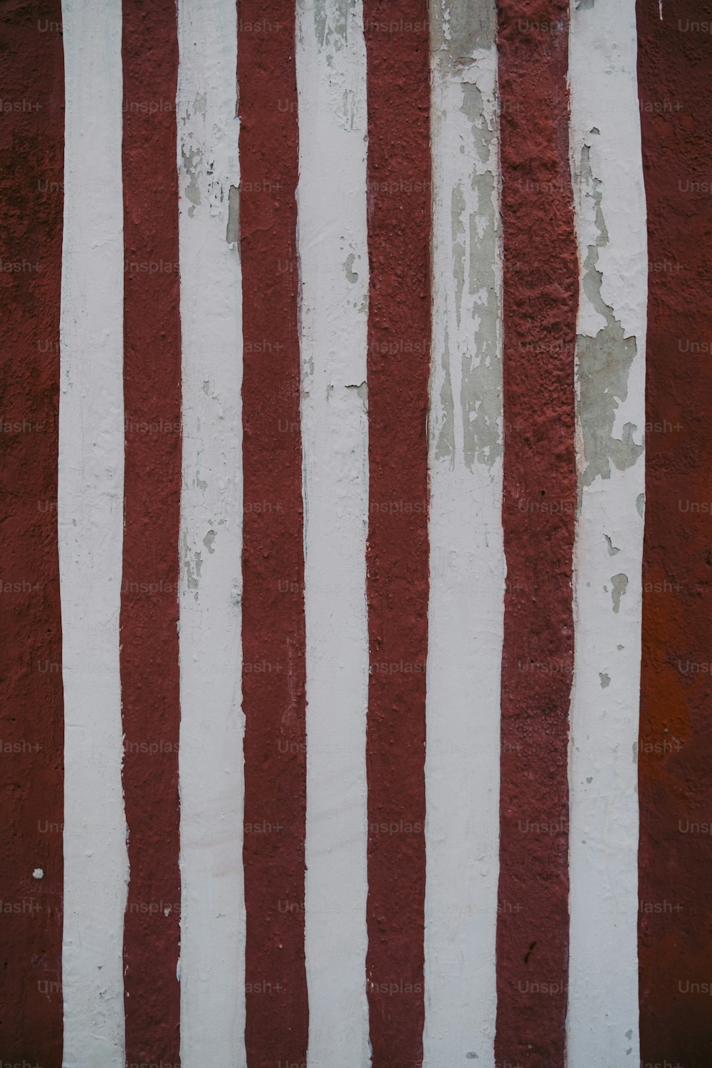 a close up of a red and white striped wall