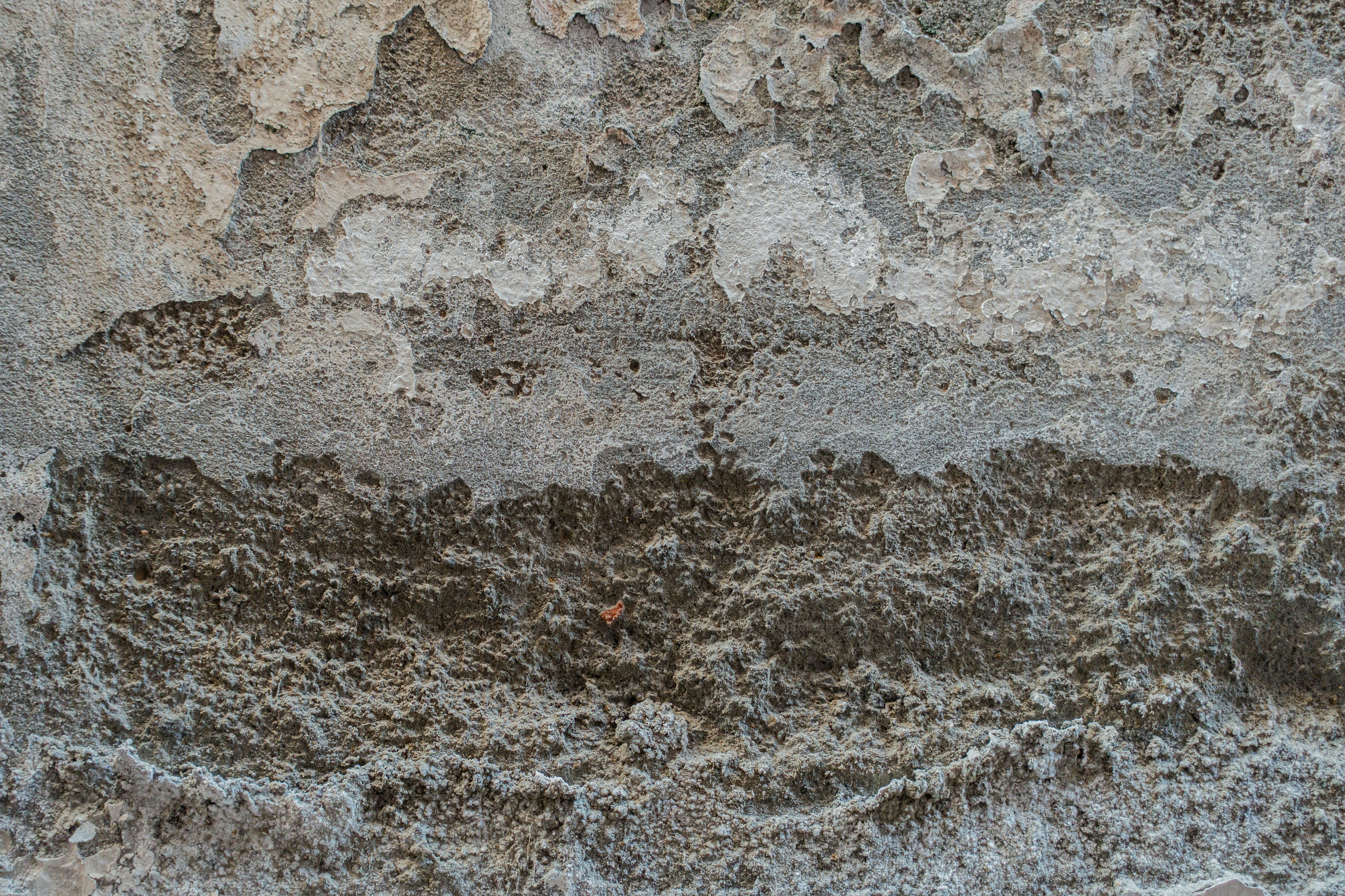 a close up of a wall with a red object in the middle of it