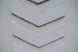 a close up of a white wall with a chevron pattern