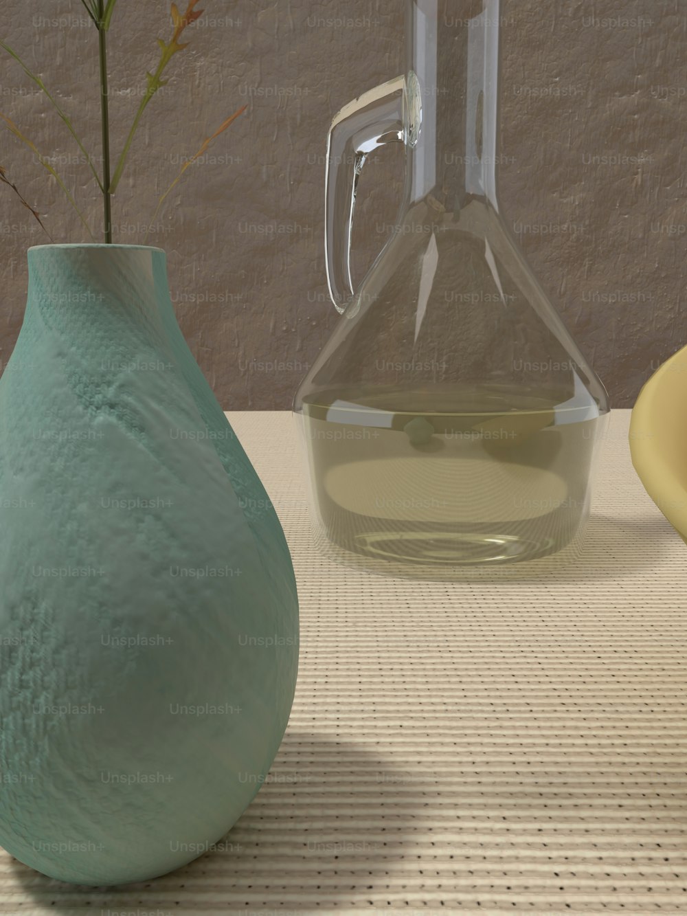 a vase with a flower in it next to a vase with a liquid in it