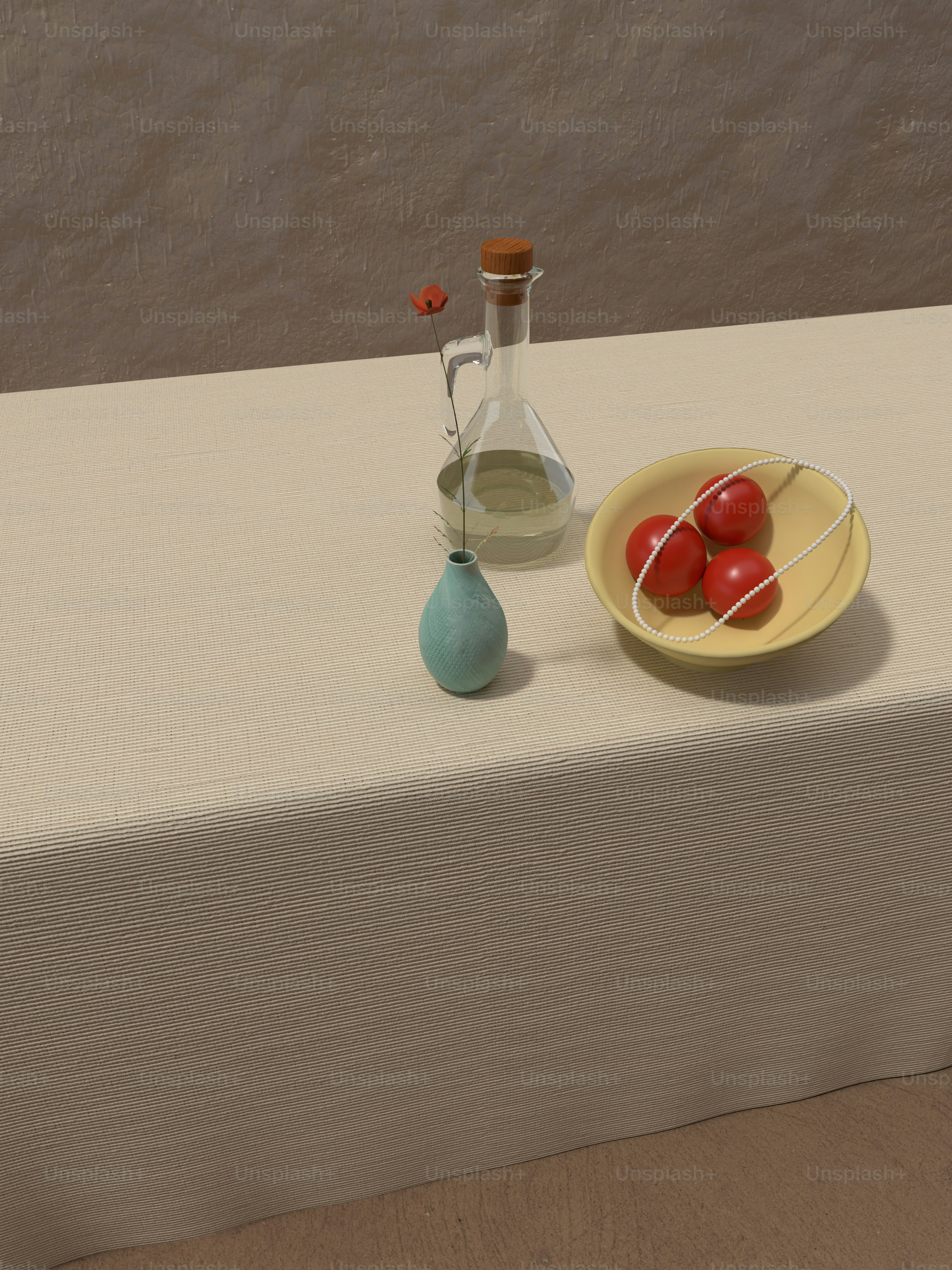 a table with a plate of tomatoes and a bottle of olive oil