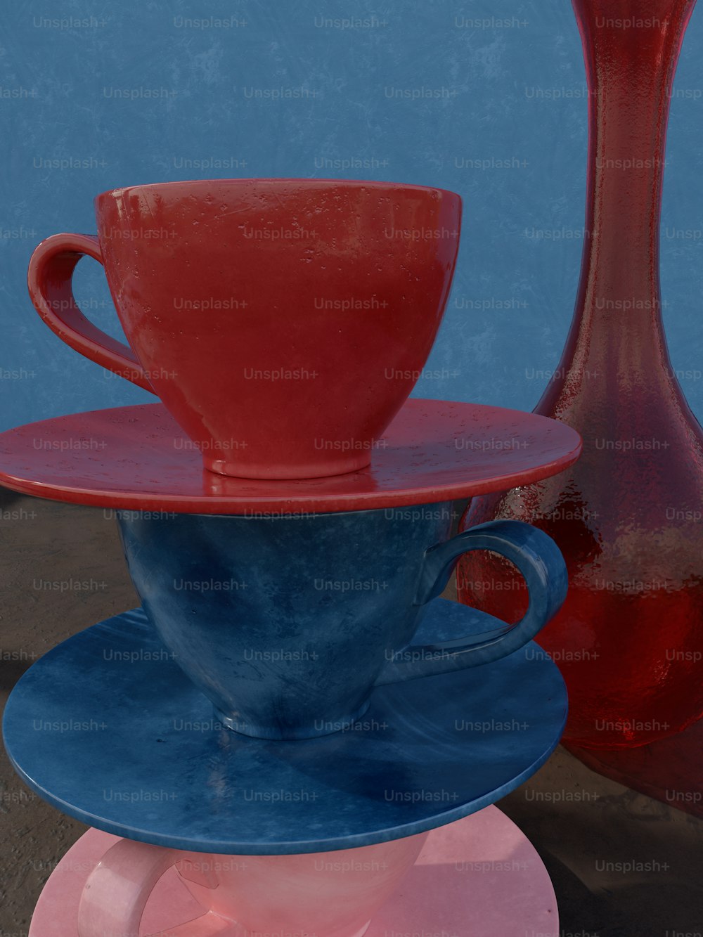 three different colored cups and saucers on a table