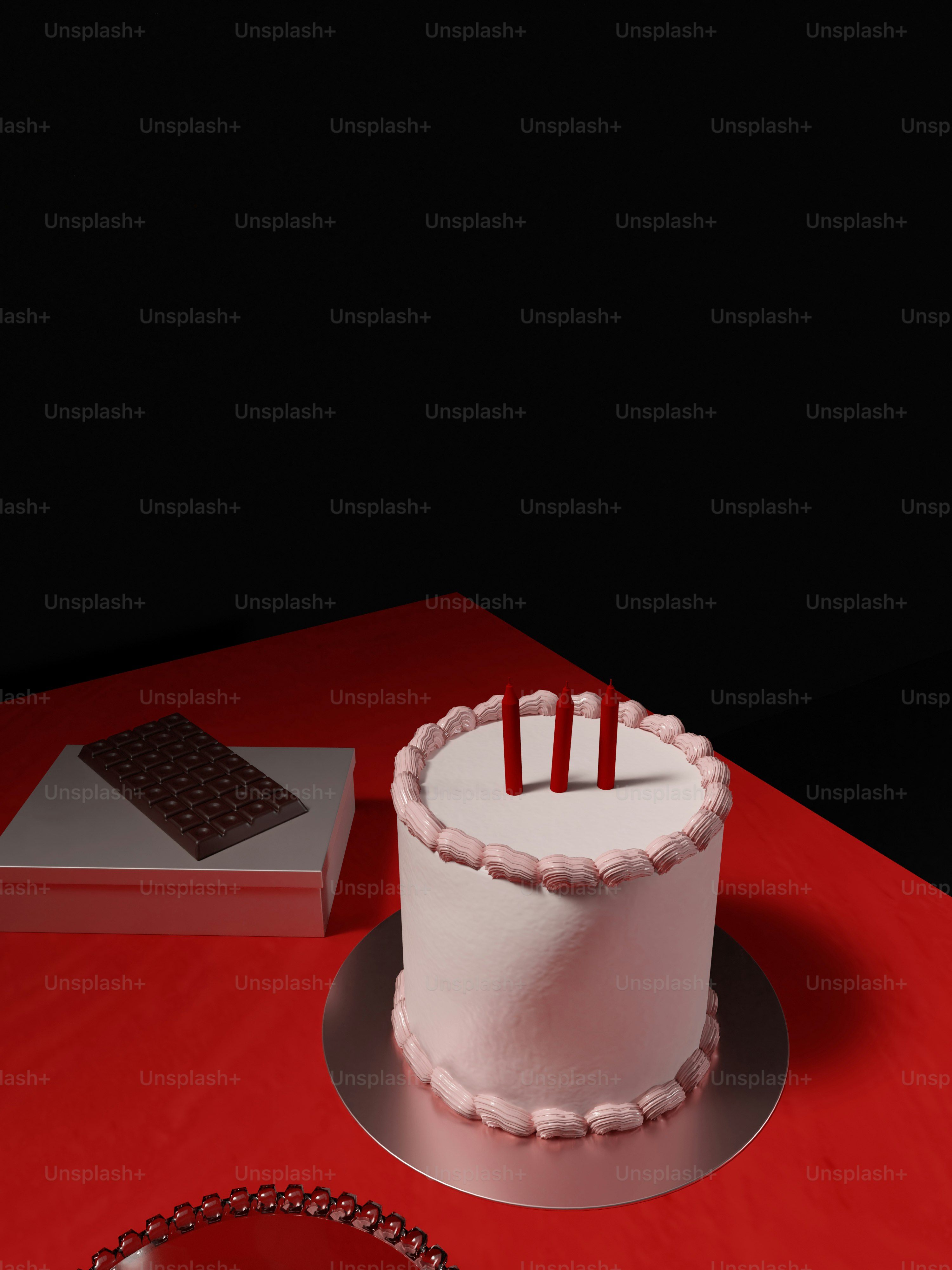 a white cake sitting on top of a red table