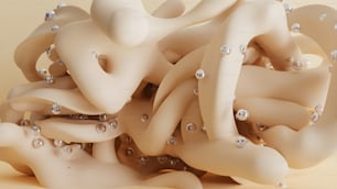 a pile of white objects with pearls on them
