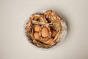 a bowl filled with eggs sitting on top of a table