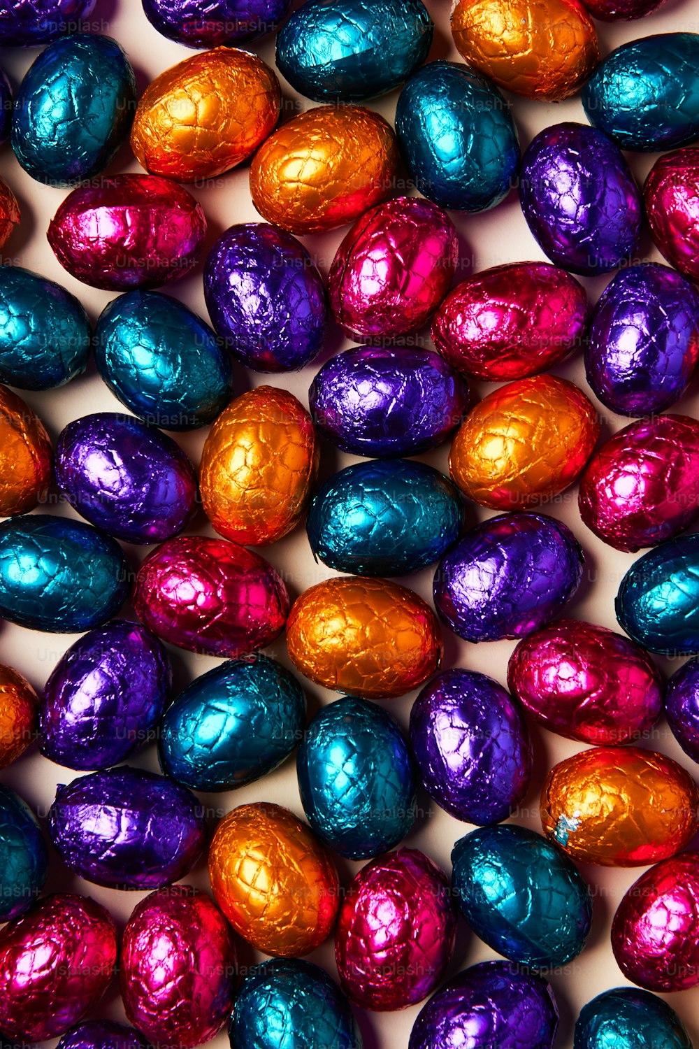 a pile of chocolate eggs sitting on top of each other