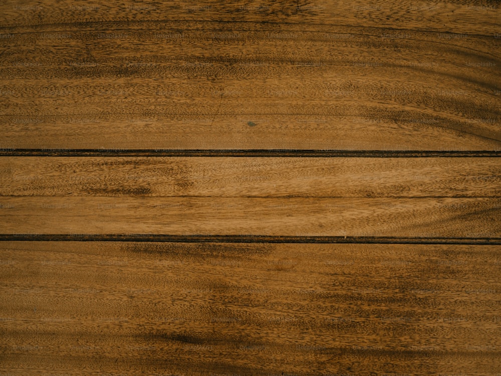 a close up of a wooden surface with knots