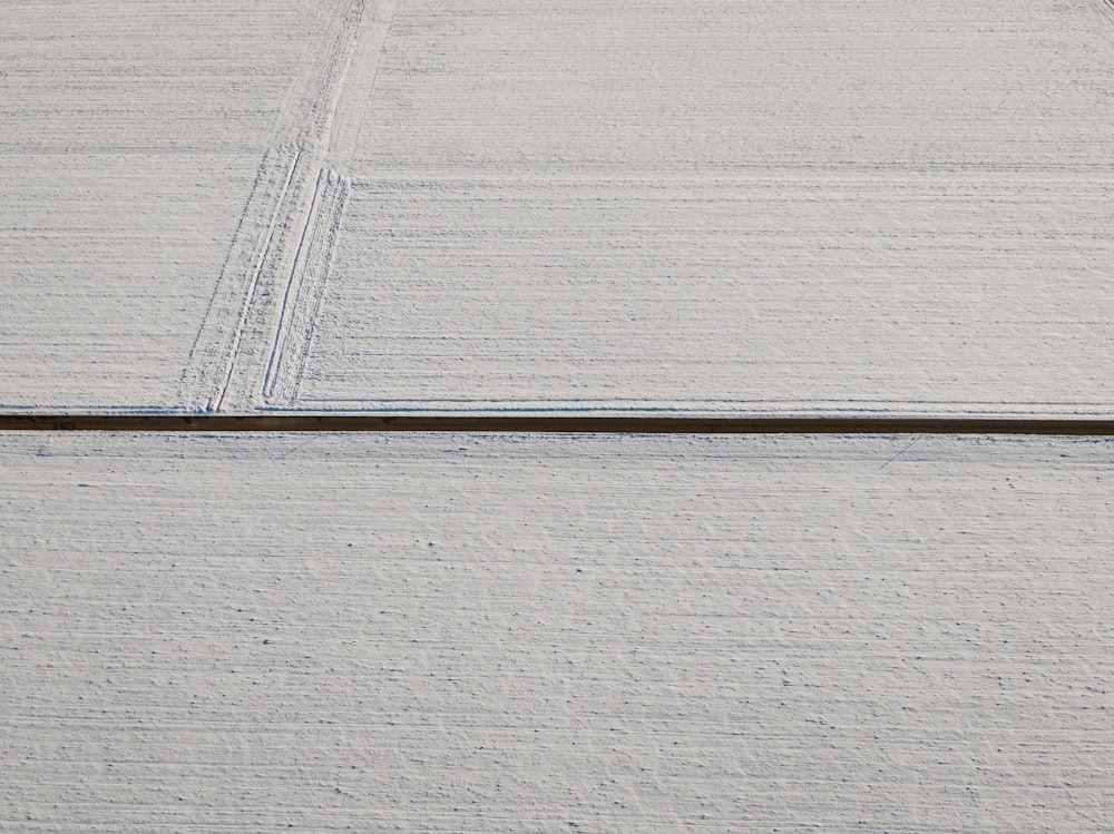 a person riding skis down a snow covered slope