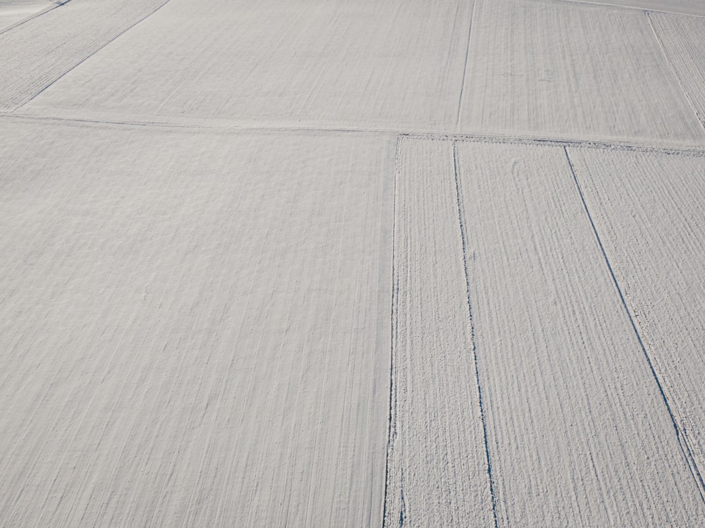 a person riding skis down a snow covered slope