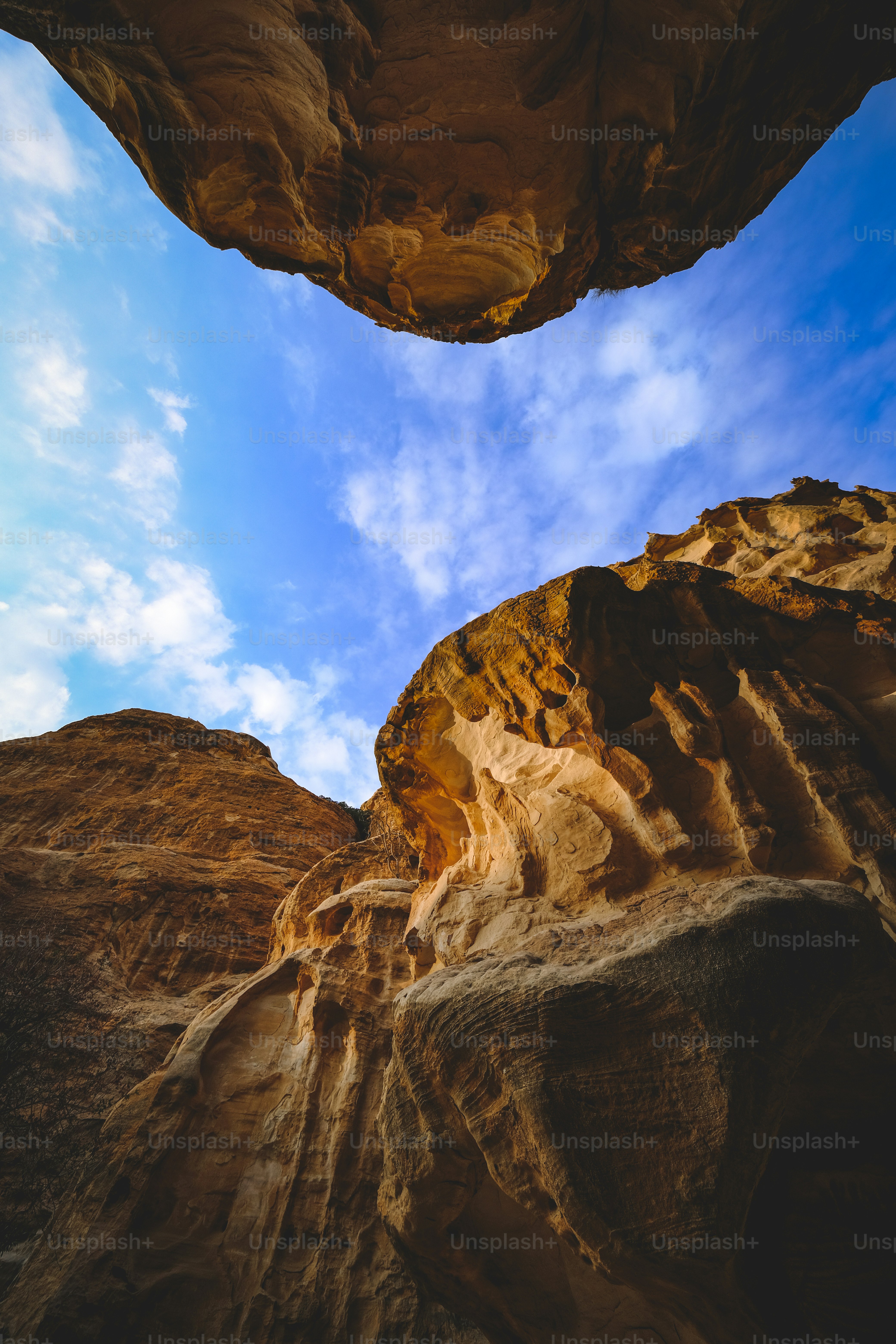 A rock formation with a blue sky in the background photo – Blue sky ...