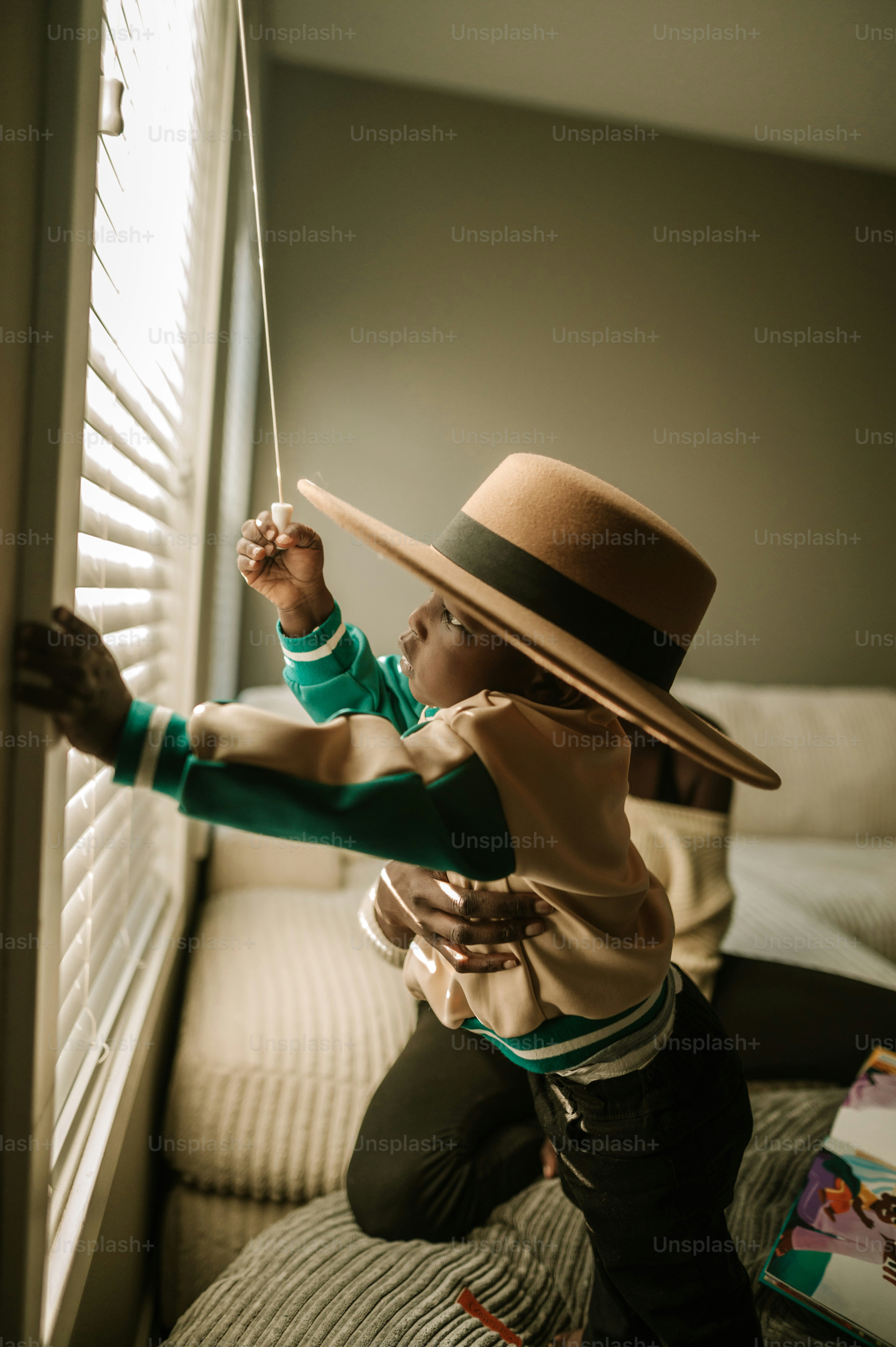 a woman wearing a hat and holding a string