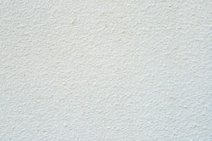 a close up of a white stucco wall